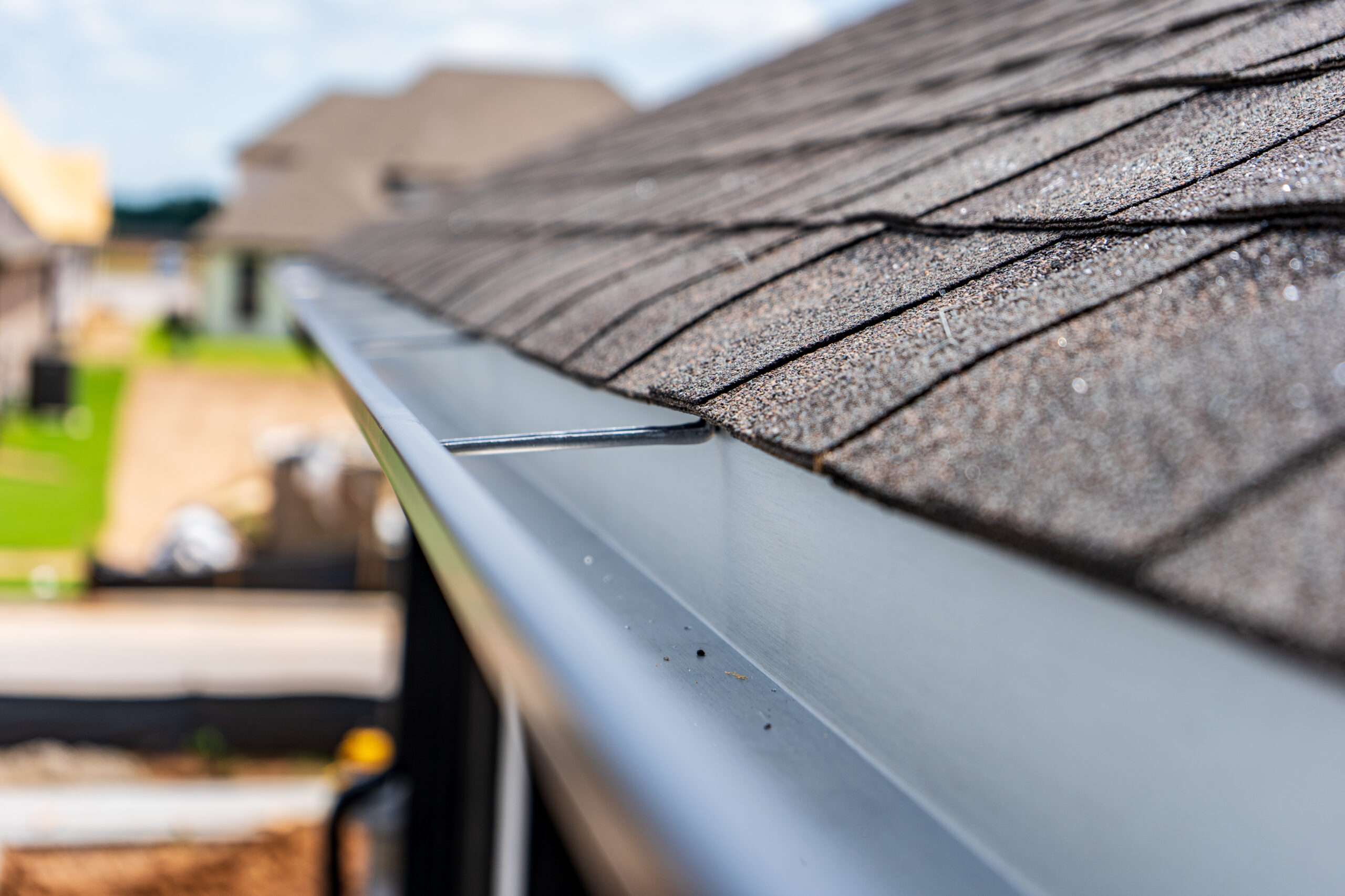 Gutters installed along roof eaves